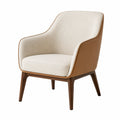 Sillón tapizado en tela beige y cuero marrón con patas de madera de haya